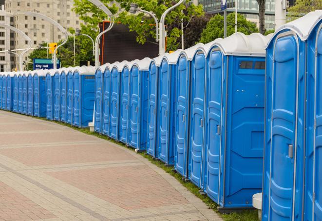 a line of portable restrooms set up for a wedding or special event, ensuring guests have access to comfortable and clean facilities throughout the duration of the celebration in Akron OH